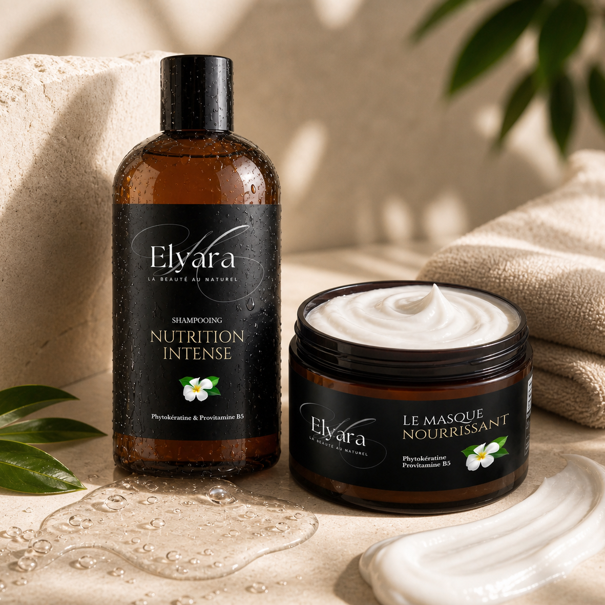 Flacon et pot de soins capillaires Élyara La Routine Complète, Duo Nutrition Intense, textures crème et shampooing sur fond beige, éclats d’eau et feuilles.
