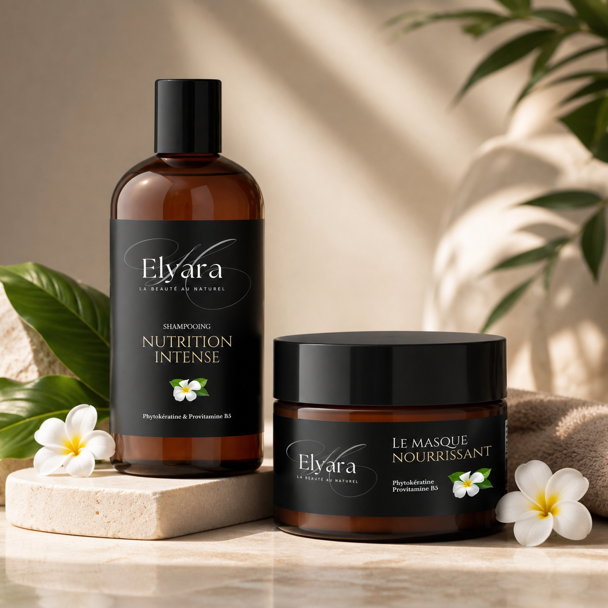 Huiles et masque Elvara de la Routine Complète, Duo Nutrition Intense: shampooing Nutrition Intense en bouteille noire et masque nourrissant en pot noir, décor naturel avec fleurs.